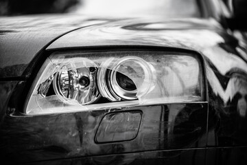 Car headlights. Exterior closeup detail.
