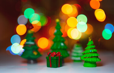 christmas tree with gifts on blurred of colorful bokeh illumination background, concept of Christmas.  