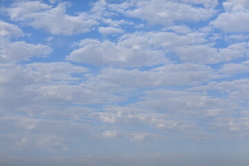 cumulus clouds against blue sky
