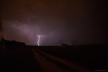 Naklejka na ściany i meble night thunderstorm in the field