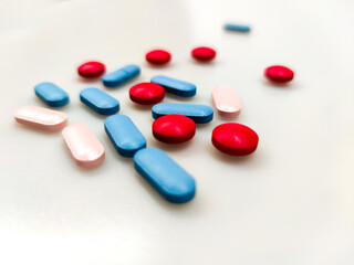 Obraz na płótnie Canvas Colorful pills on the table