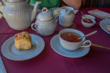 Table served with cup of tea and a scon