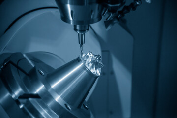 The  5 axis CNC milling machine cutting the turbine blade parts with solid ball end-mill tools. The...