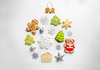 Christmas round composition made of winter decorations and gingerbread on white background. Christmas concept. Flat lay, top view.