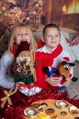 Brother and Sister, Joyful Children in Red Scarf. Concept Meeting Christmas, New Year in the Family
