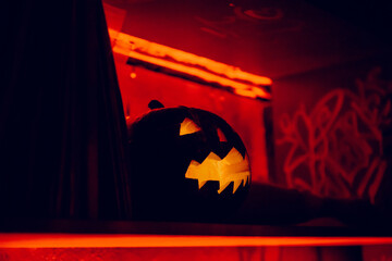 Jack-o-lantern pumpkin in a bar at Halloween