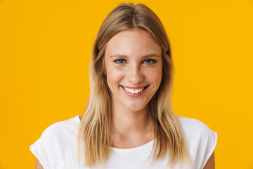 Cheerful beautiful girl smiling and looking at camera