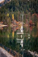 Weather Station in an Alpine Lake, Lago di Tovel in Italian Alps, National Park of Adamello Brenta....