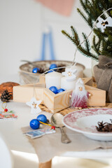 Preparing Christmas decorations. Christmas decor. White Scandinavian table with Christmas decoration. Christmas mood.