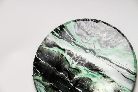 Planet colorful waves in resin art technique