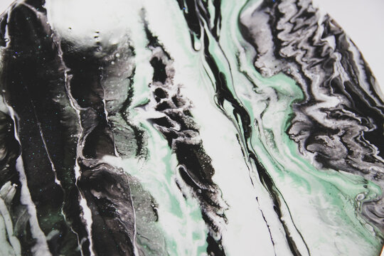 Macro photo of abctract green and black resin art