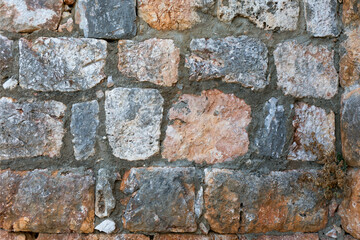 Antique stone wall. Old bricks background.