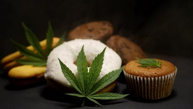 Cannabis edibles. CBD oil sweets. Marijuana leaf. Smoke effect
