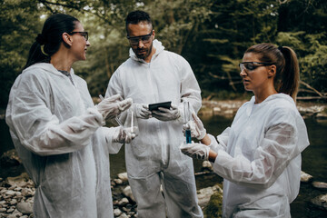 Team of scientists and biologists researching possibilities for bacteria and virus spreading through natural flowing supplies of drinking water.