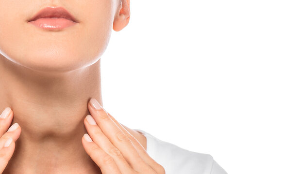 Woman palpation her neck, examine thyroid gland. Enlarged thyroid gland, close-up on white background