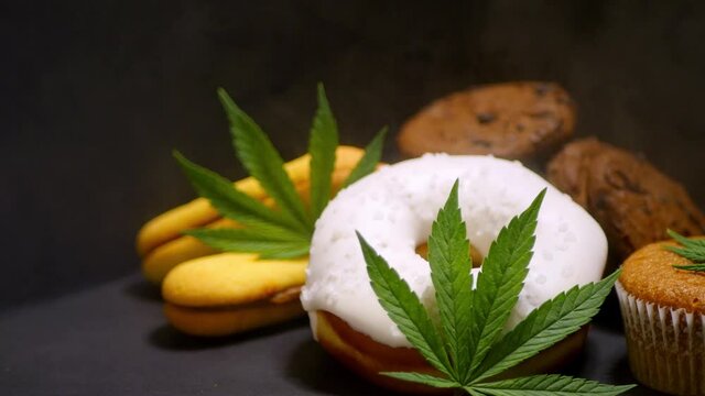 Cannabis edibles. CBD oil sweets. Marijuana leaf. Smoke effect