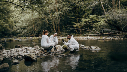 Team of scientists and biologists researching possibilities for bacteria and virus spreading through natural flowing supplies of drinking water.