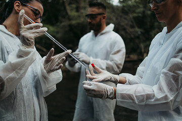 Team of scientists and biologists researching possibilities for bacteria and virus spreading through natural flowing supplies of drinking water.