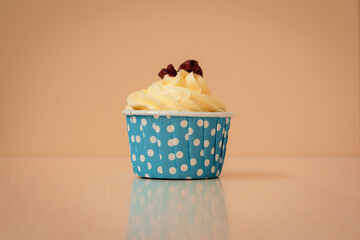 Cupcake close-up on beige background