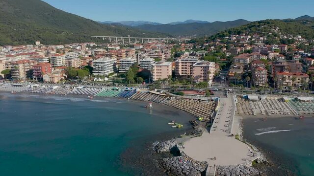 drone shot revealing the city of andora, liguria