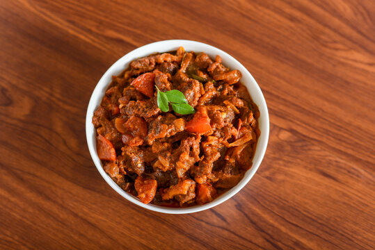 Spicy beef curry. Goan style beef vindaloo. Traditional Indian Lamb or beef curry . spicy Beef curry gravy popular in Kerala Sri Lankan Goa for Appam, Parotta porotta in India.