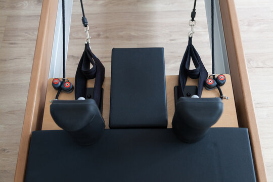 Reformer pilates studio machine for fitness workouts in gym