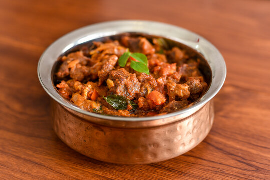 Spicy beef curry. Goan style beef vindaloo. Traditional Indian Lamb or beef curry . spicy Beef curry gravy popular in Kerala Sri Lankan Goa for Appam, Parotta porotta in India.