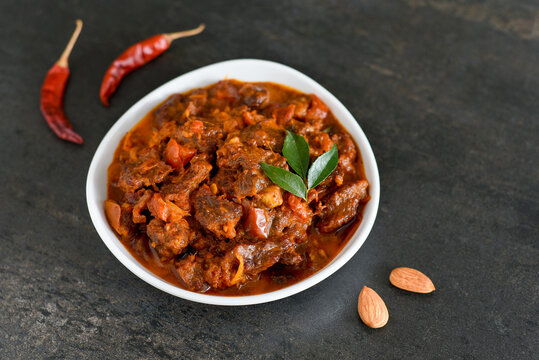 Spicy beef curry. Goan style beef vindaloo. Traditional Indian Lamb or beef curry . spicy Beef curry gravy popular in Kerala Sri Lankan Goa for Appam, Parotta porotta in India.