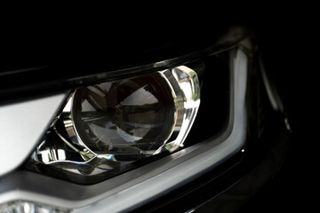Abstract and close up of dark tone luxury car headlights. for transtport technology background.