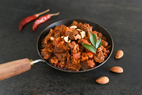 Spicy beef curry. Goan style beef vindaloo. Traditional Indian Lamb or beef curry . spicy Beef curry gravy popular in Kerala Sri Lankan Goa for Appam, Parotta porotta in India.