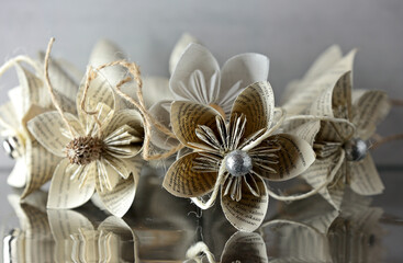 Decorative paper flowers hand made of book pages
