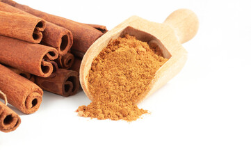 Cinnamon sticks and cinnamon powder isolated on white background, healthy spice, (Cinnamomum)
