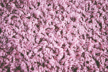 Carpet fibers close up. purple carpet texture, top view.