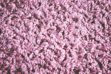 Obraz premium Carpet fibers close up. purple carpet texture, top view.