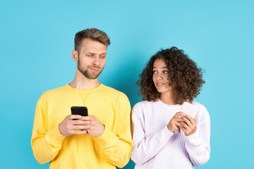 Afro american woman and european man standing on blue background