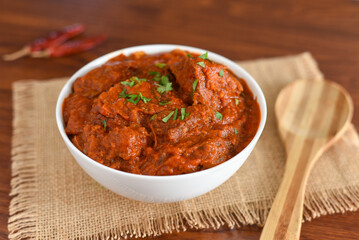 Spicy red fish curry  Goan style fish vindaloo ,  chilly  fish curry Indian Food curry Goa India . spicy Kerala Bengali fish curry side dish for Appam, rice , roti , chapati