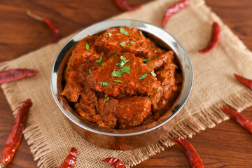 Spicy red fish curry  Goan style fish vindaloo ,  chilly  fish curry Indian Food curry Goa India . spicy Kerala Bengali fish curry side dish for Appam, rice , roti , chapati