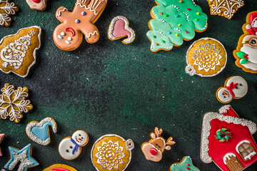 Various Sugar Glazed festive Christmas and New Year sweet cookies background card. Simple pattern with Christmas home baked Cookies over dark green background