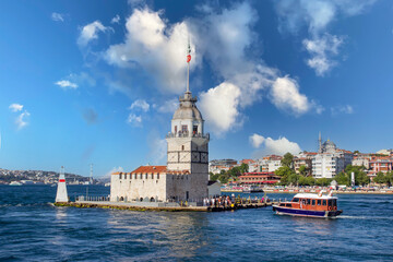 Fototapeta premium ISTANBUL, TURKEY - JULY 26, 2019: view of Maiden's Tower (Kiz Kulesi) situated on Bosphorus, symbol of Istanbul, Turkey. Sunny day view of the Maiden's Tower