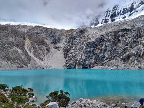 Laguna Paron, Huaraz, Peru. A blue-green lake in the Cordillera Blanca on the Peruvian Andes. At 4185 meters above sea level, it's surrounded by snowy peaks and a pyramid mountain. 