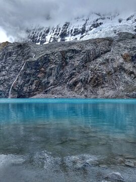 Laguna Paron, Huaraz, Peru. A blue-green lake in the Cordillera Blanca on the Peruvian Andes. At 4185 meters above sea level, it's surrounded by snowy peaks and a pyramid mountain. 