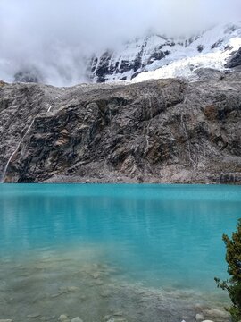 Laguna Paron, Huaraz, Peru. A blue-green lake in the Cordillera Blanca on the Peruvian Andes. At 4185 meters above sea level, it's surrounded by snowy peaks and a pyramid mountain. 