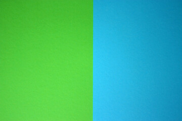 Double colored paper as a background. Blue and green. Minimal design. Copy space. Flat lay backdrop.