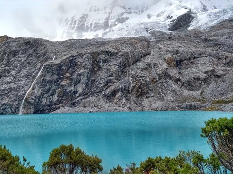 Laguna Paron, Huaraz, Peru. A blue-green lake in the Cordillera Blanca on the Peruvian Andes. At 4185 meters above sea level, it's surrounded by snowy peaks and a pyramid mountain. 