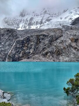 Laguna Paron, Huaraz, Peru. A blue-green lake in the Cordillera Blanca on the Peruvian Andes. At 4185 meters above sea level, it's surrounded by snowy peaks and a pyramid mountain. 