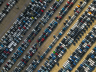 Aerial shot of parked cars in a structured row parking lease cars new production industry