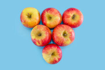 red apples on a blue background. view from above.
