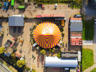Aerial view of a circus tent colorfull red yellow entertainment show drone shot © Sepia100