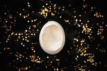 Eggshell on black fur with gold glitter close-up
