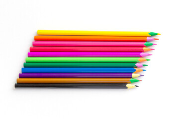 Fototapeta premium Multi-colored pencils are laid out on a white background. isolate. Hobby, drawing.